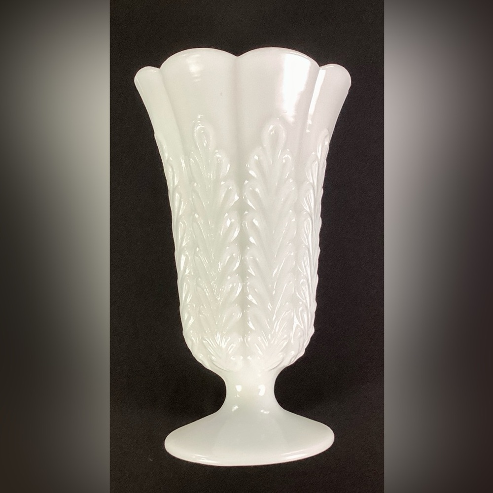 E O Brody-9.5” vintage,footed and ribbed milk glass vase